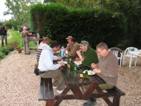 Exterior dining area at Molyneux carp lake in France.