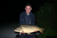 A 21lb Carp from  in Apr 2006 by Steve get his paws on a lovely 21lb Carp