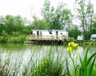 The mobile sits between the Carp & Cat lake at Morgane carp lake in France. 