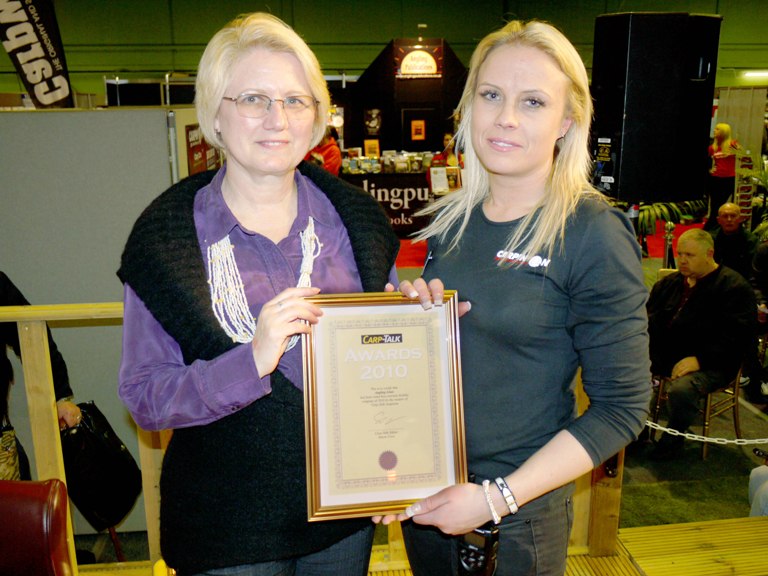 Linda Latham receiving the award Award for carp fishing holiday company Angling Lines
