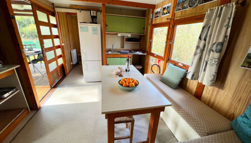 Golden Carp Lake, Big Carp Fishing France with a Social Lodge, Cabin Seating/Dining Area