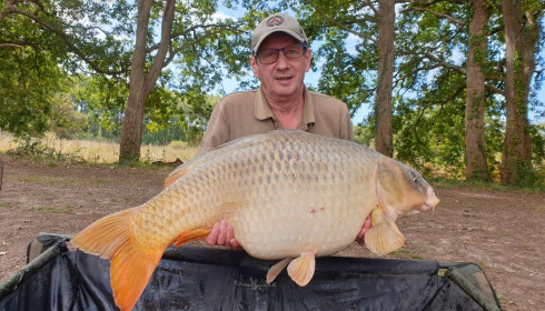 A 56 lb fish from Laroussi, the third of the triple take and a lake record ghost common, Aug 2020