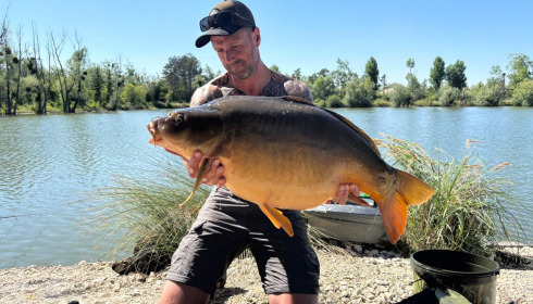 A 34 lb carp from Grandes Cimes, Buschell, Jul 2026