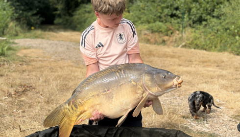 A 34 lb 9 oz carp from Carp House, Aug 2026