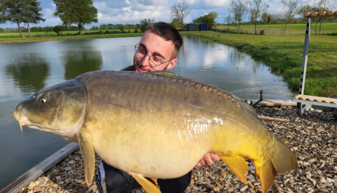 A 35 lb 2 oz carp from Heart Lake, Apr 2023