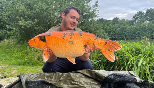 A fish from Jonchery 7, Josh with a nice koi, Jul 2023