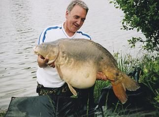 A 53 lb carp from Laroussi, Deep bodied mirror, May 2007