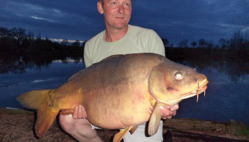 A 48 lb 7 oz carp from Villefond, The long two tone fish getting involved in the spawning, Apr 2013