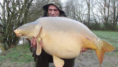 A 43 lb 10 oz carp from Villefond, Micks Mirror caught by John Lambert held by gavin rose, Jan 2012